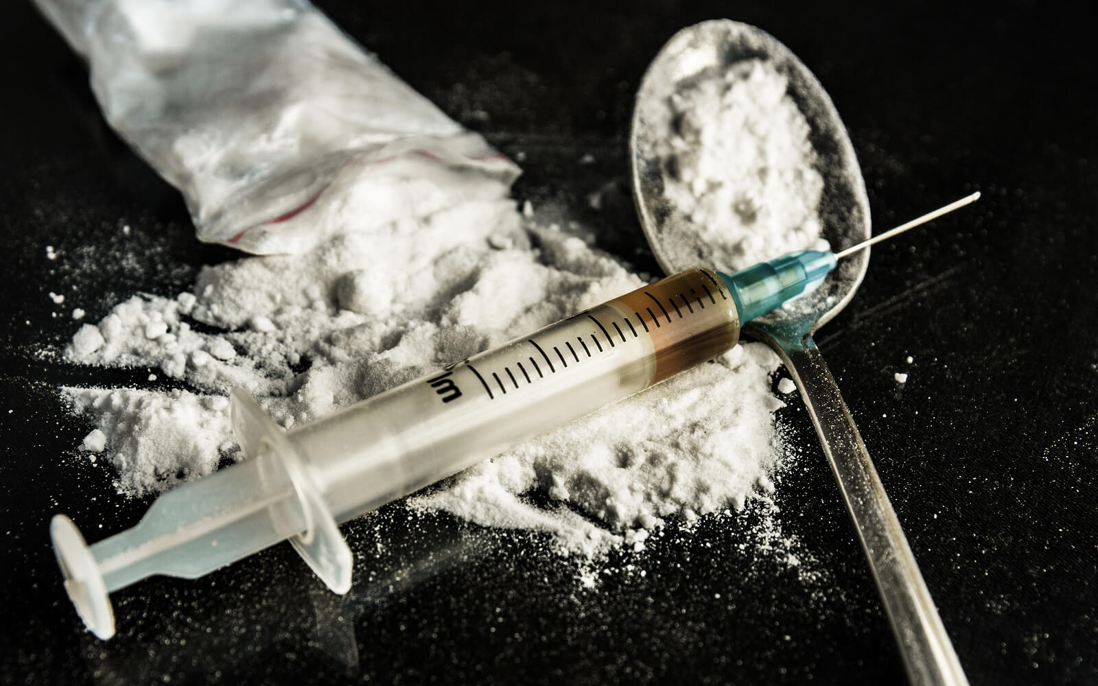 bigstock Drug Syringe And Cooked Heroin 76081889