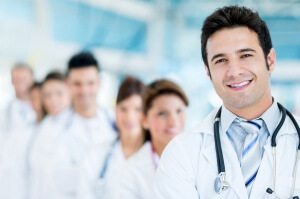 Male doctor at the hospital with his team