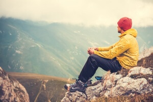Man Traveler relaxing alone in Mountains Travel Lifestyle