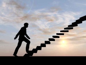 Concept conceptual 3D male businessman on stair or steps over su
